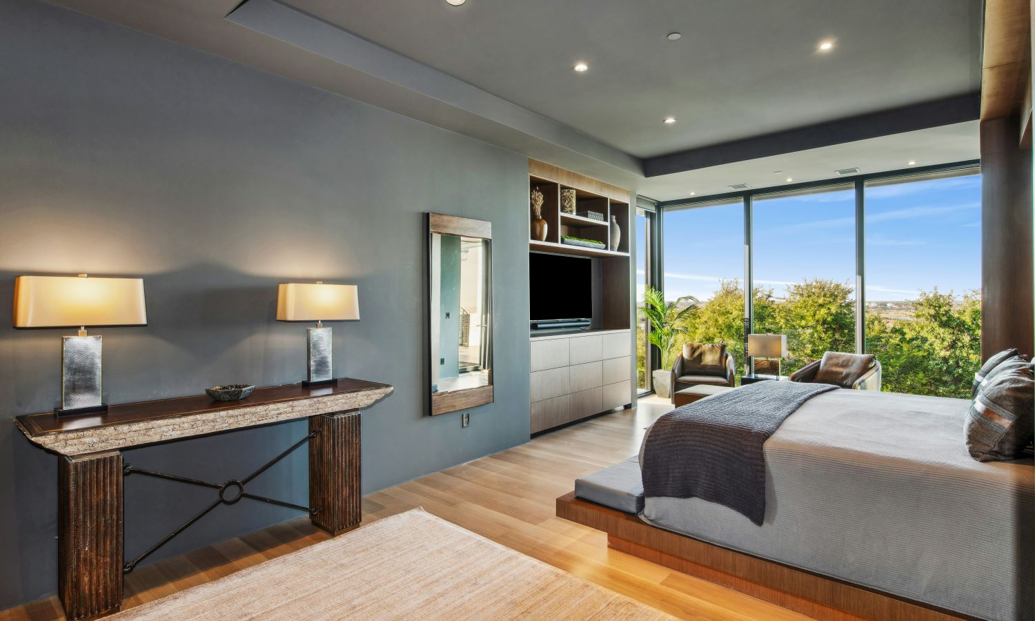 man checking his phone while walking down the stairs