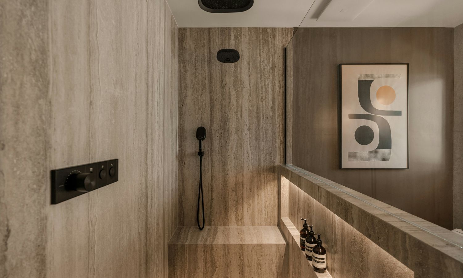 man checking his phone while walking down the stairs