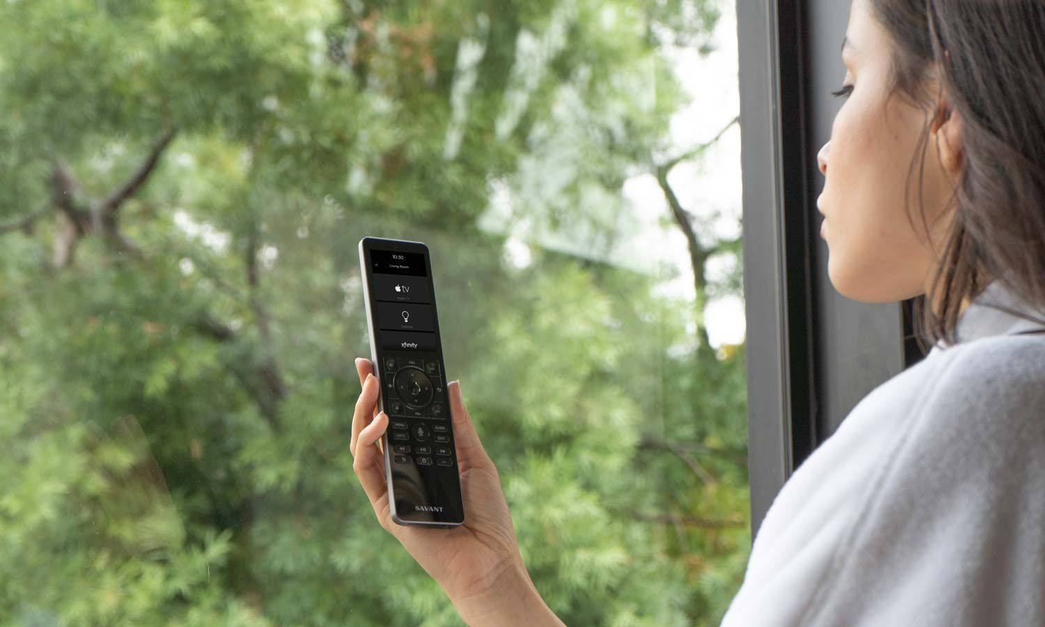 man checking his phone while walking down the stairs