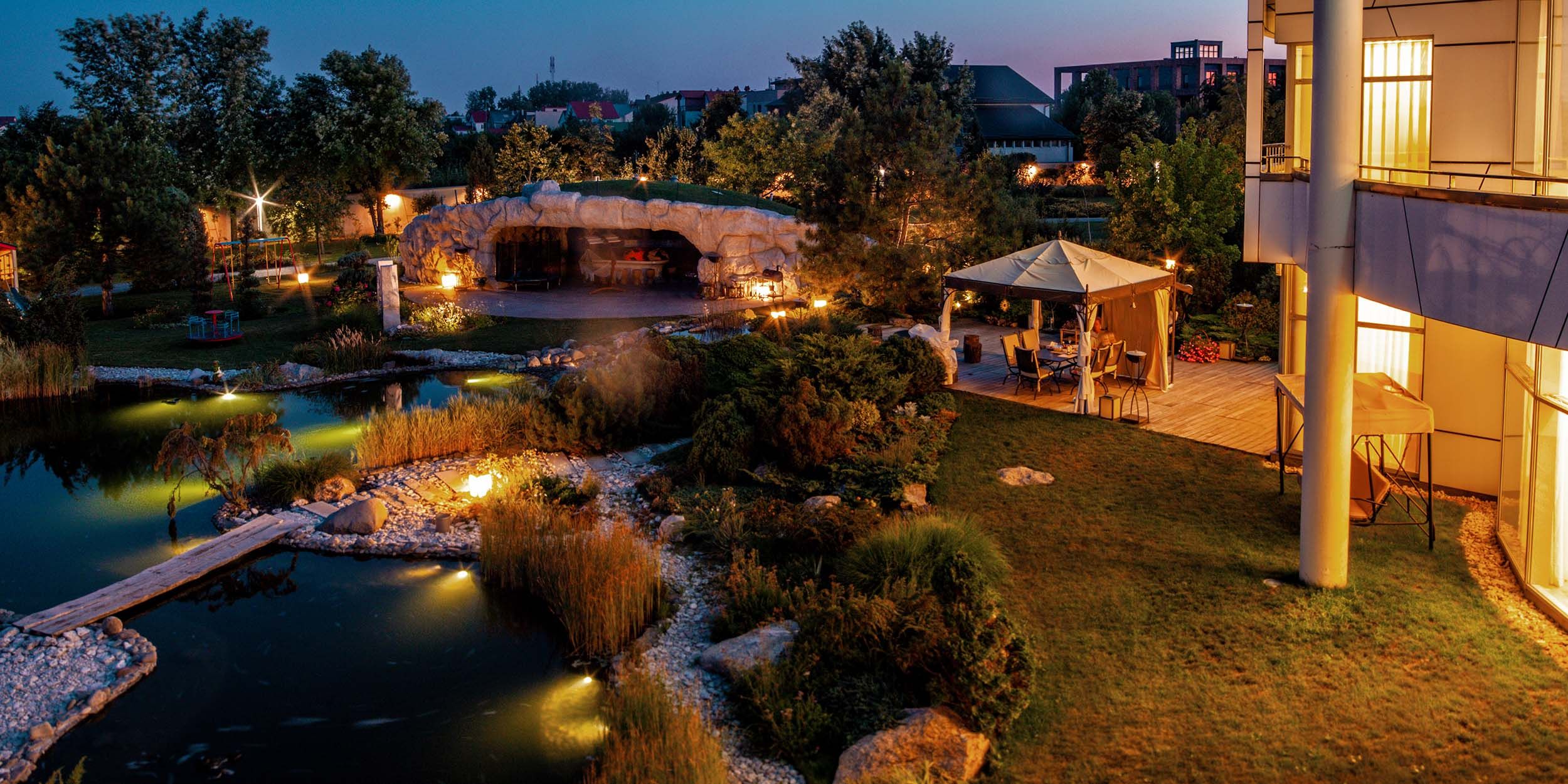 outdoor landscape with lighting and outdoor sitting area