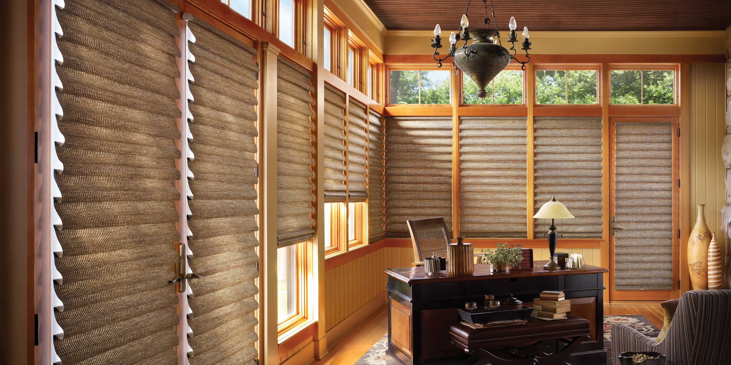 warm toned home office with Hunter Douglas shades